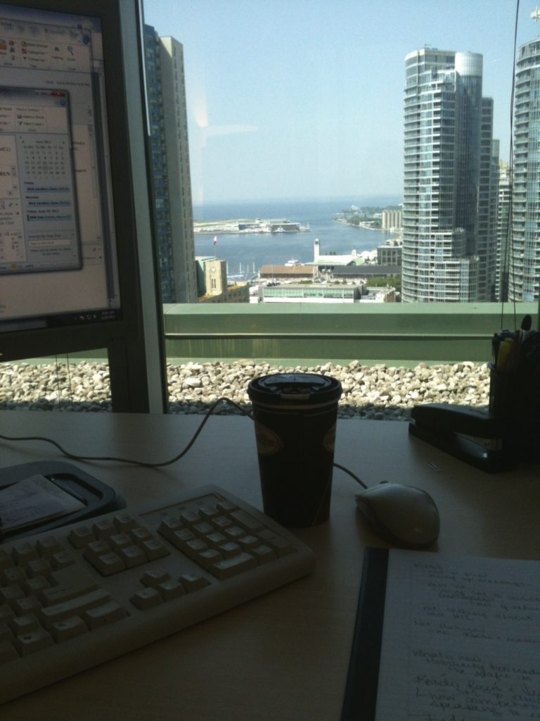 View of Lake Ontario and high-rises in office at McCann